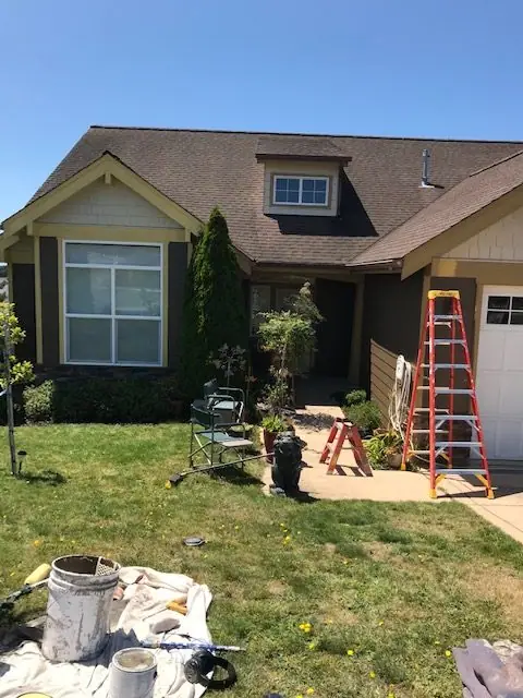 Front of a home, drop cloths down