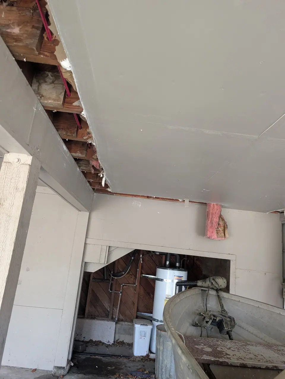 Torn out: the old carport ceiling off along the beam, down to the joists