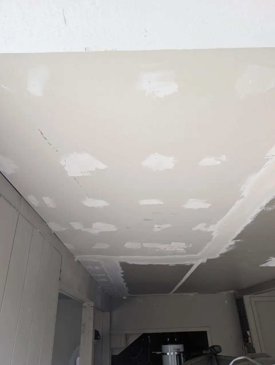 Up close: the new ceiling with its seams and screw holes mudded